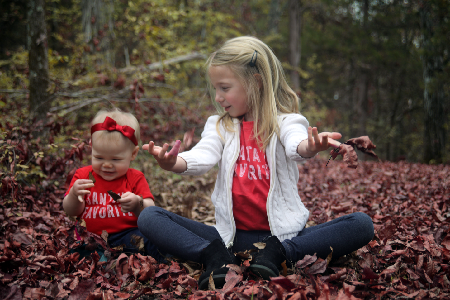 Riley is wearing 12mo; her big sis Natalie is wearing 5/6 toddler